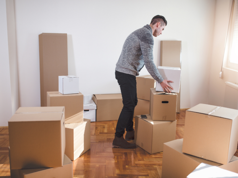 Man packing boxes for moving